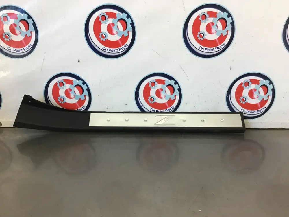 03-09 Nissan 350Z Passenger Right Door Kick Plate 769B0CD000 OEM 24BCJD7